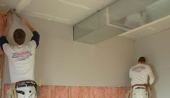 Photo of Standard Drywall employees doing a comemrcial drywall installation